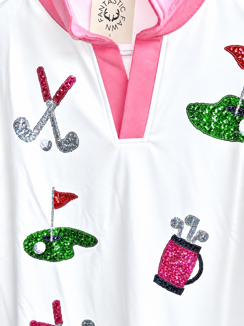 Definitely a hole in one with this cute Sequin golf shirt pink white green